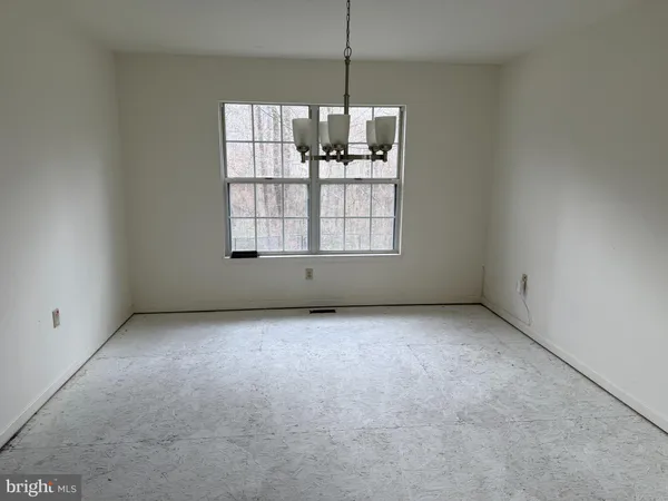 a view of a kitchen with a dishwasher cabinets and a window