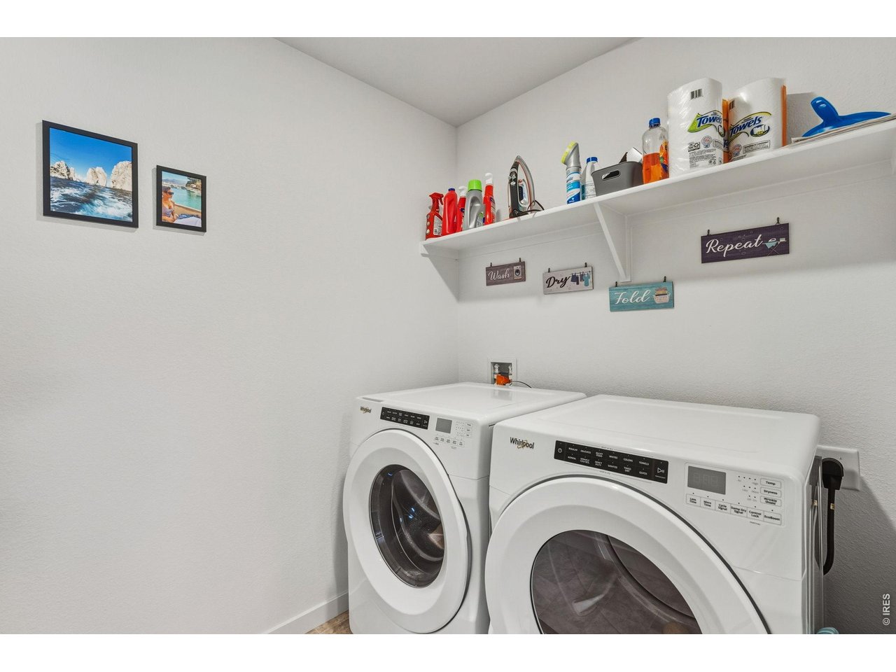 438 Bluebird Road Johnstown, CO 80534 - Photo 28 of 33 Dedicated laundry room with included washer and dryer and overhead shelving.