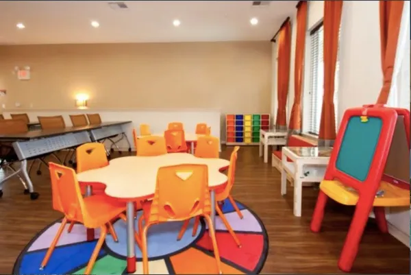 a dining room with furniture and wooden floor