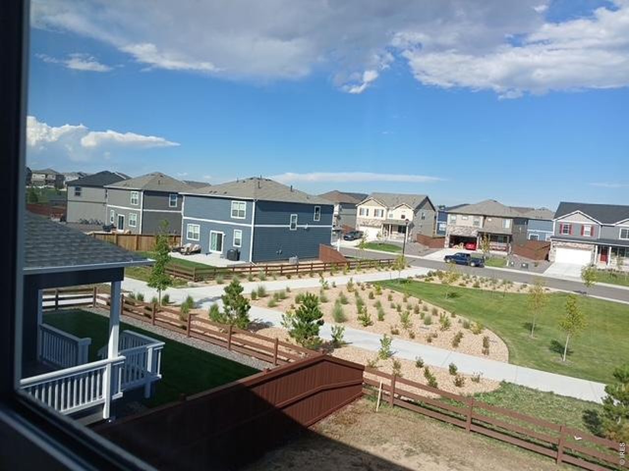 439 Bluebird Road Johnstown, CO 80534 - Photo 31 of 36 a view of a swimming pool with a lounge chairs