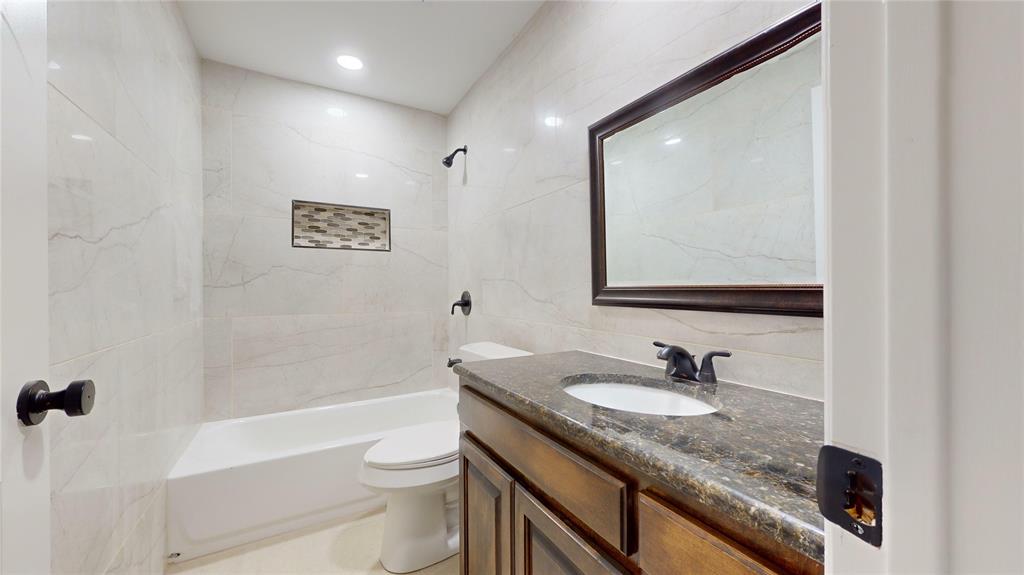 8545 Midpark Road, Unit 10 Dallas, TX 75240 - Photo 2 of 31 a bathroom with a granite countertop sink toilet and shower