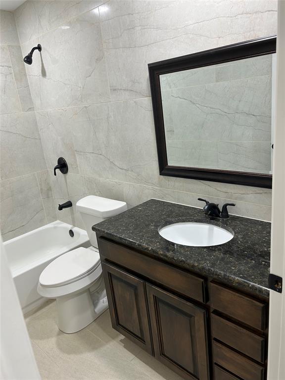 8545 Midpark Road, Unit 10 Dallas, TX 75240 - Photo 22 of 31 a bathroom with a granite countertop sink and a mirror