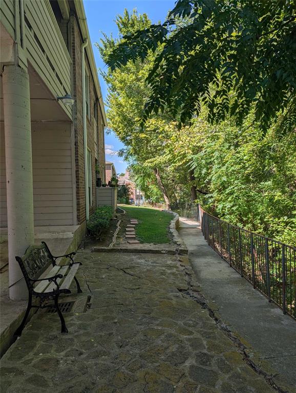 8545 Midpark Road, Unit 10 Dallas, TX 75240 - Photo 29 of 31 a view of backyard with outdoor seating and green space