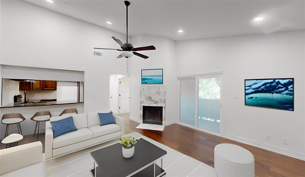 8545 Midpark Road, Unit 10 Dallas, TX 75240 - Photo 4 of 31 a living room with furniture fireplace and flat screen tv