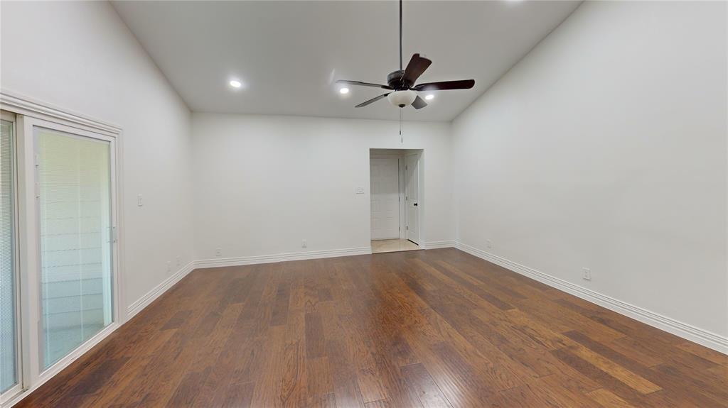 8545 Midpark Road, Unit 10 Dallas, TX 75240 - Photo 6 of 31 a view of empty room with wooden floor