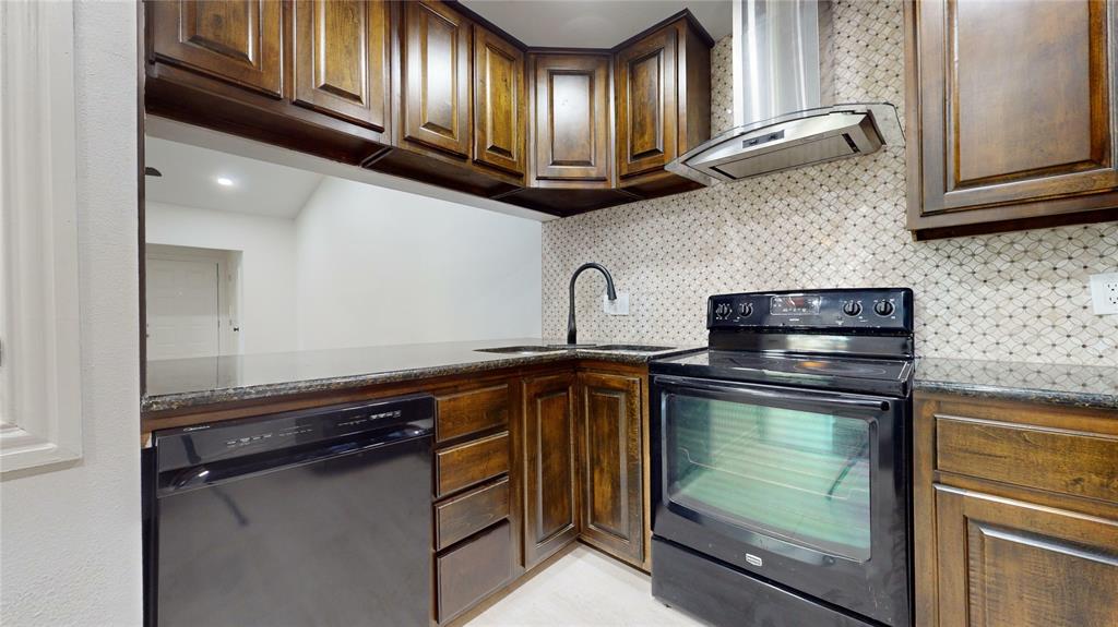 8545 Midpark Road, Unit 10 Dallas, TX 75240 - Photo 10 of 31 a kitchen with stainless steel appliances granite countertop a stove and a microwave