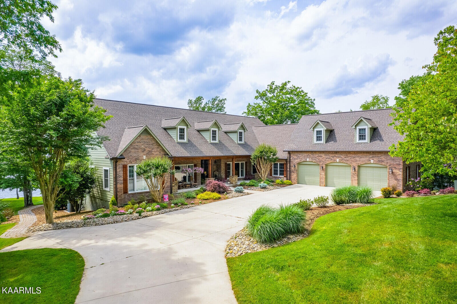 16 Milnor Circle Crossville, TN 38558 - Photo 1 of 50 a view of a white house with a big yard plants and large trees