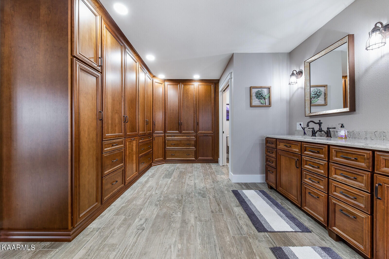 16 Milnor Circle Crossville, TN 38558 - Photo 21 of 50 a spacious bathroom with a double vanity sink and a large mirror