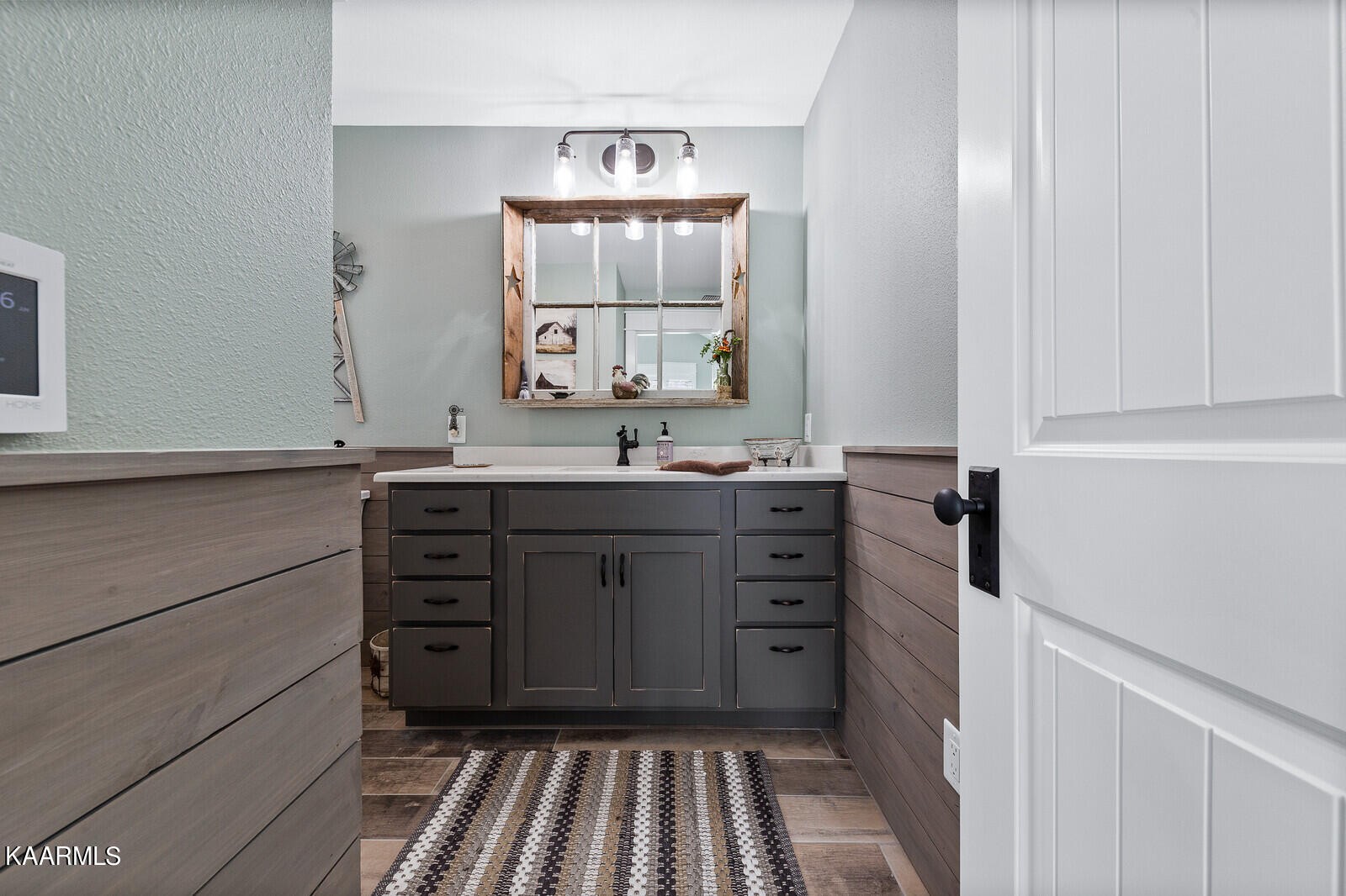 16 Milnor Circle Crossville, TN 38558 - Photo 26 of 50 a bathroom with a sink vanity and mirror