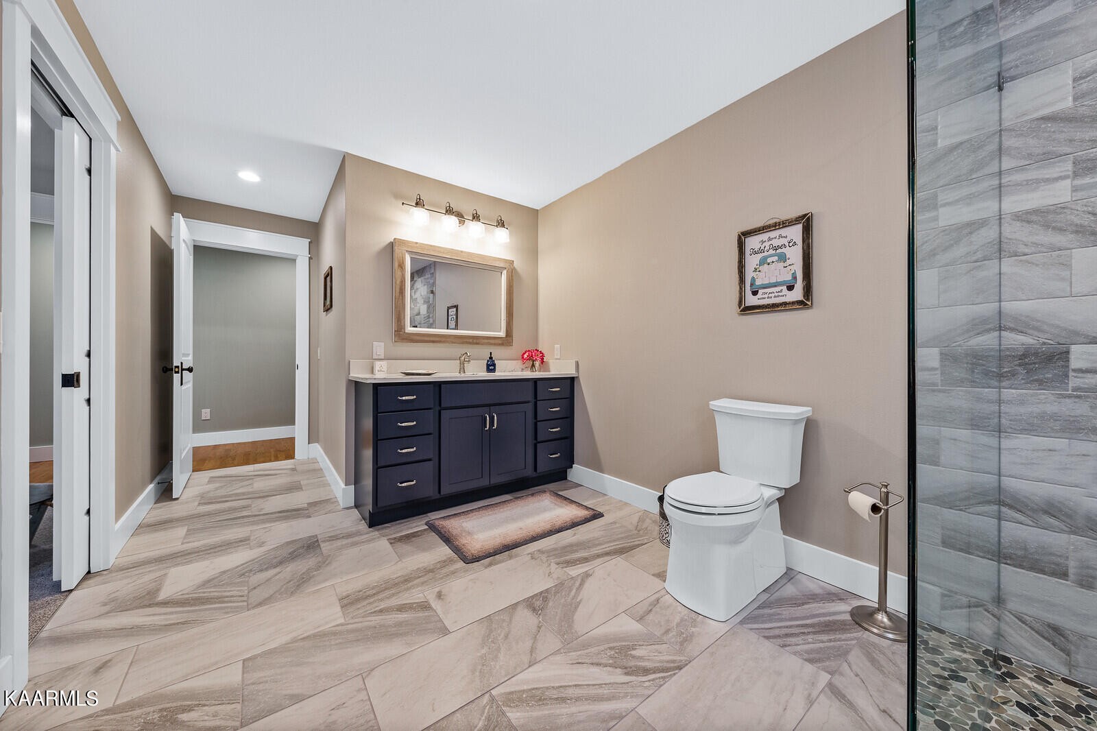 16 Milnor Circle Crossville, TN 38558 - Photo 30 of 50 a bathroom with a toilet a sink and mirror