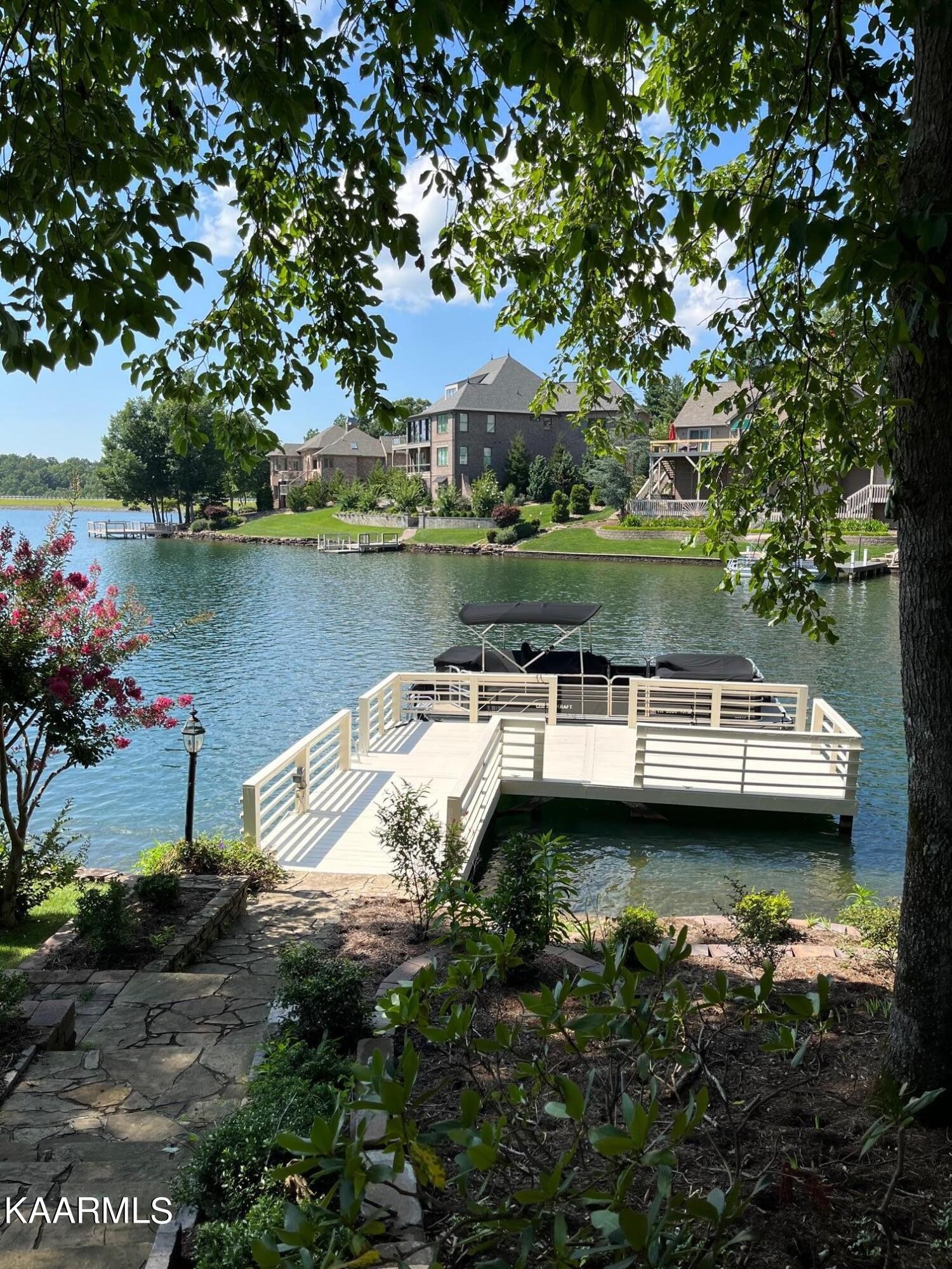 16 Milnor Circle Crossville, TN 38558 - Photo 45 of 50 a view of a lake with a house in the background