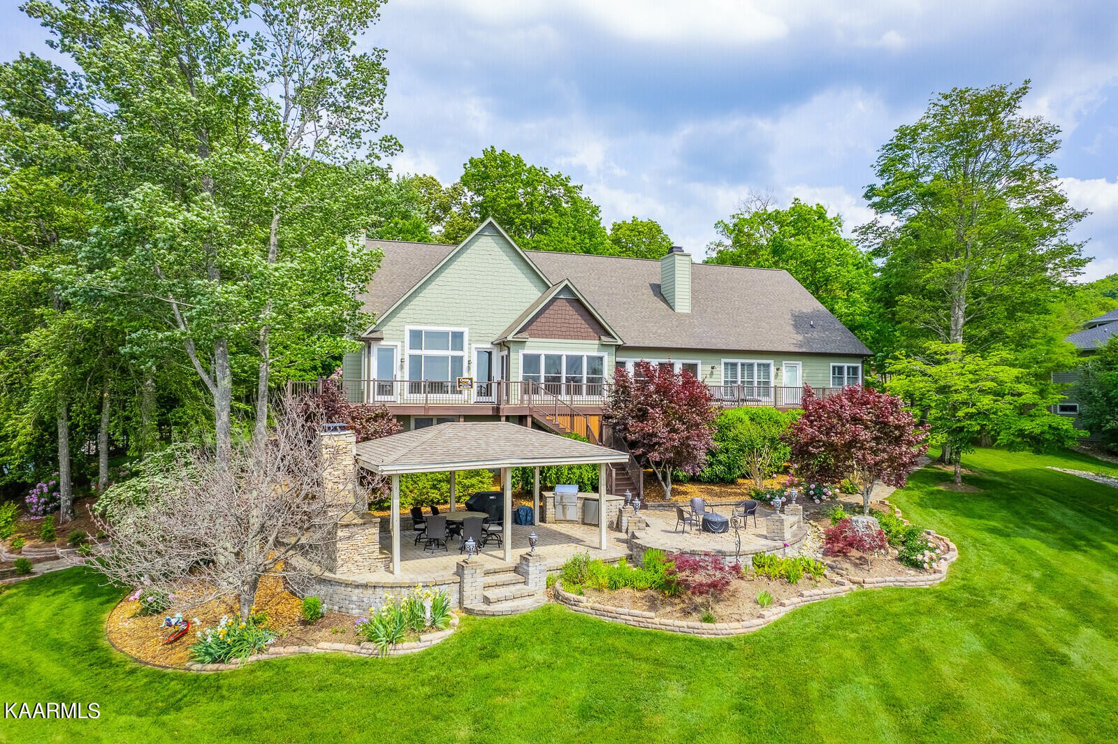 16 Milnor Circle Crossville, TN 38558 - Photo 47 of 50 a view of a house with backyard sitting area and garden
