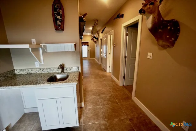 a kitchen with a sink and cabinets