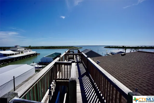 a bathroom with a granite countertop sink a mirror and a shower