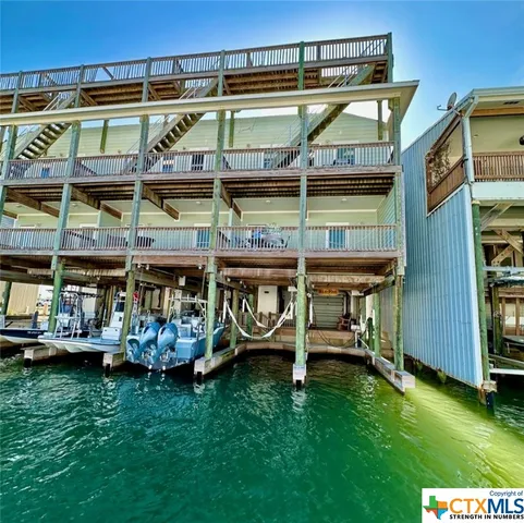 a view of a chairs and table in the patio