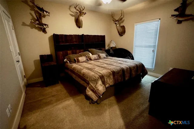 a bedroom with a bed and window