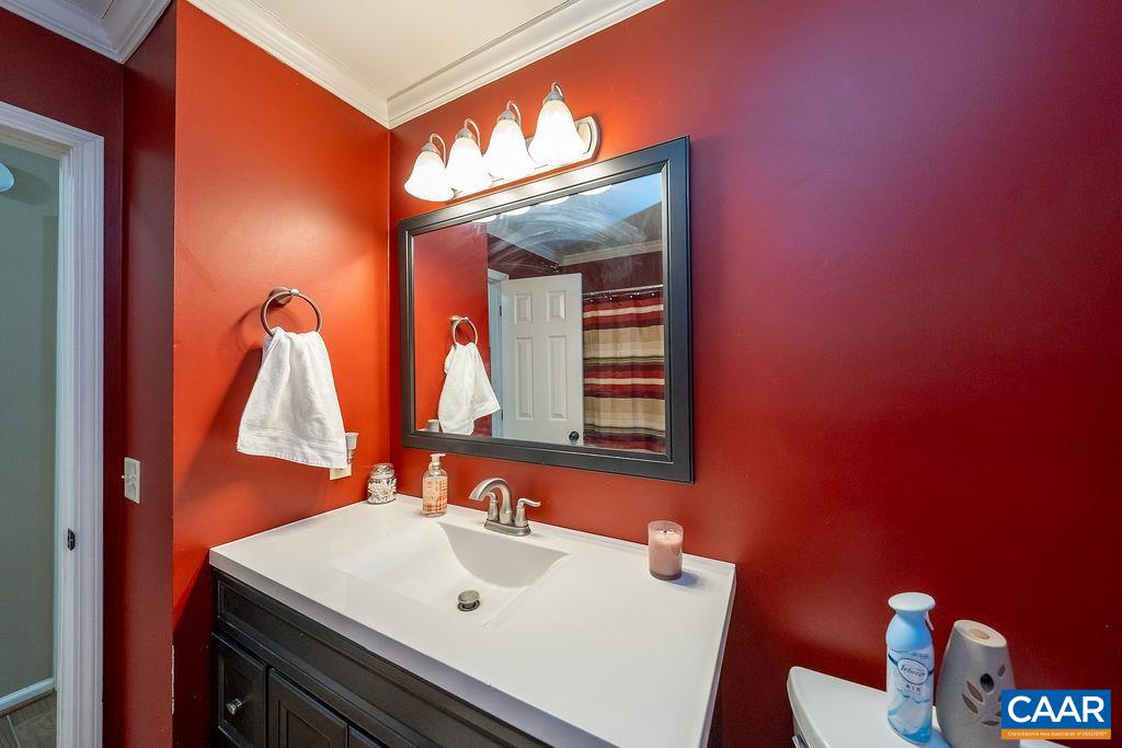 1425 Jacks Shop Road Rochelle, VA 22738 - Photo 27 of 66 a bathroom with a sink and a mirror