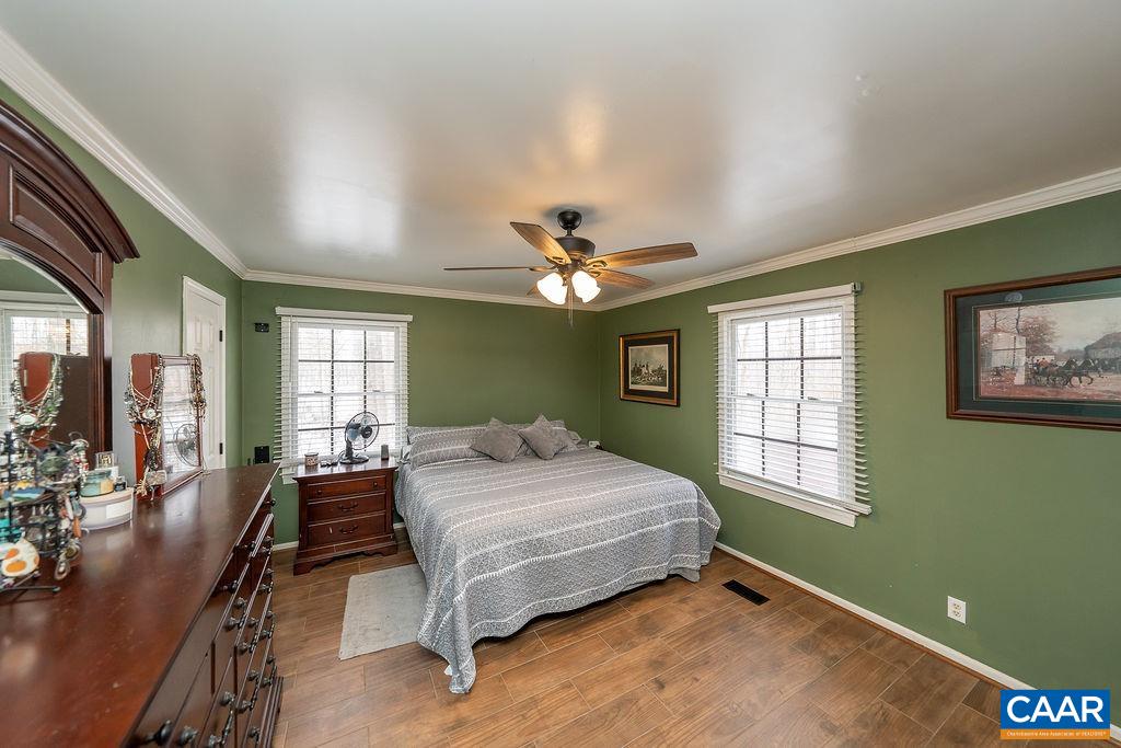 1425 Jacks Shop Road Rochelle, VA 22738 - Photo 28 of 66 a bedroom with a bed and a chandelier