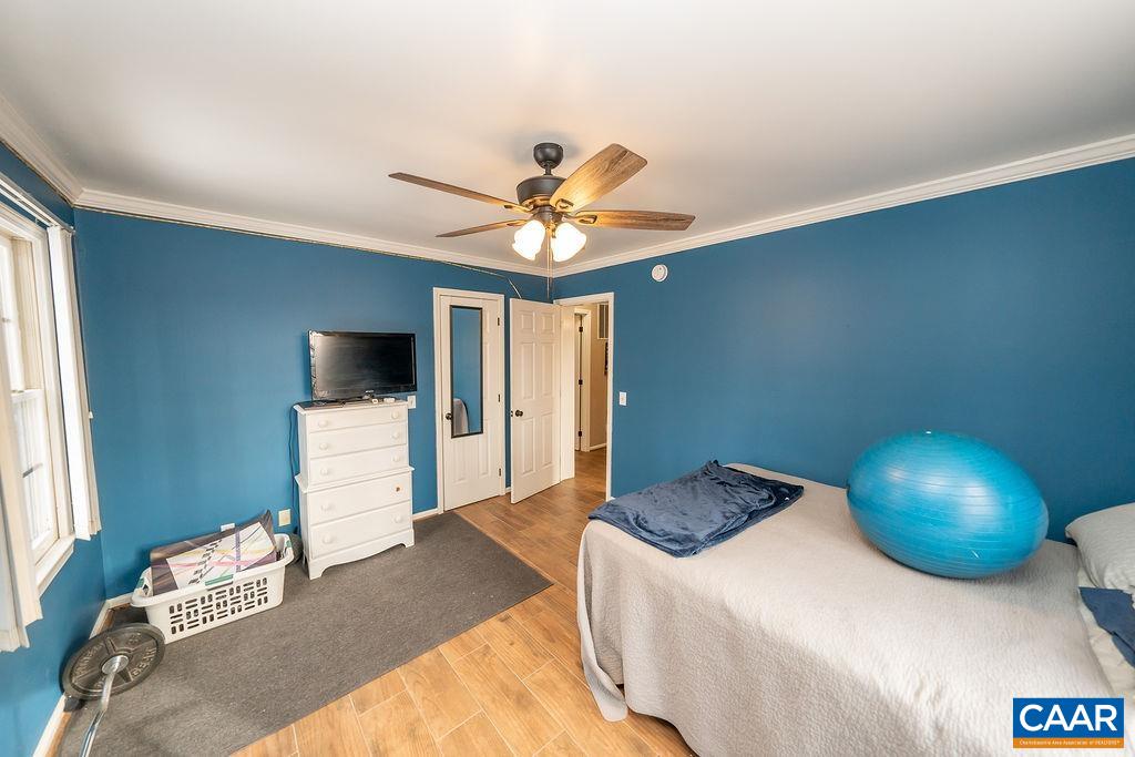 1425 Jacks Shop Road Rochelle, VA 22738 - Photo 32 of 66 a bedroom with a bed and a tv