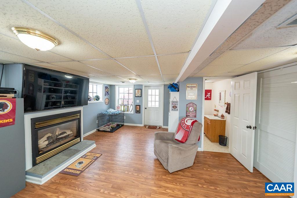 1425 Jacks Shop Road Rochelle, VA 22738 - Photo 42 of 66 a living room with furniture fireplace and flat screen tv