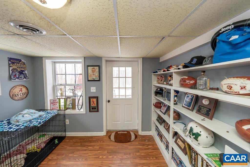 1425 Jacks Shop Road Rochelle, VA 22738 - Photo 46 of 66 a living room with lots of furniture and baby bed