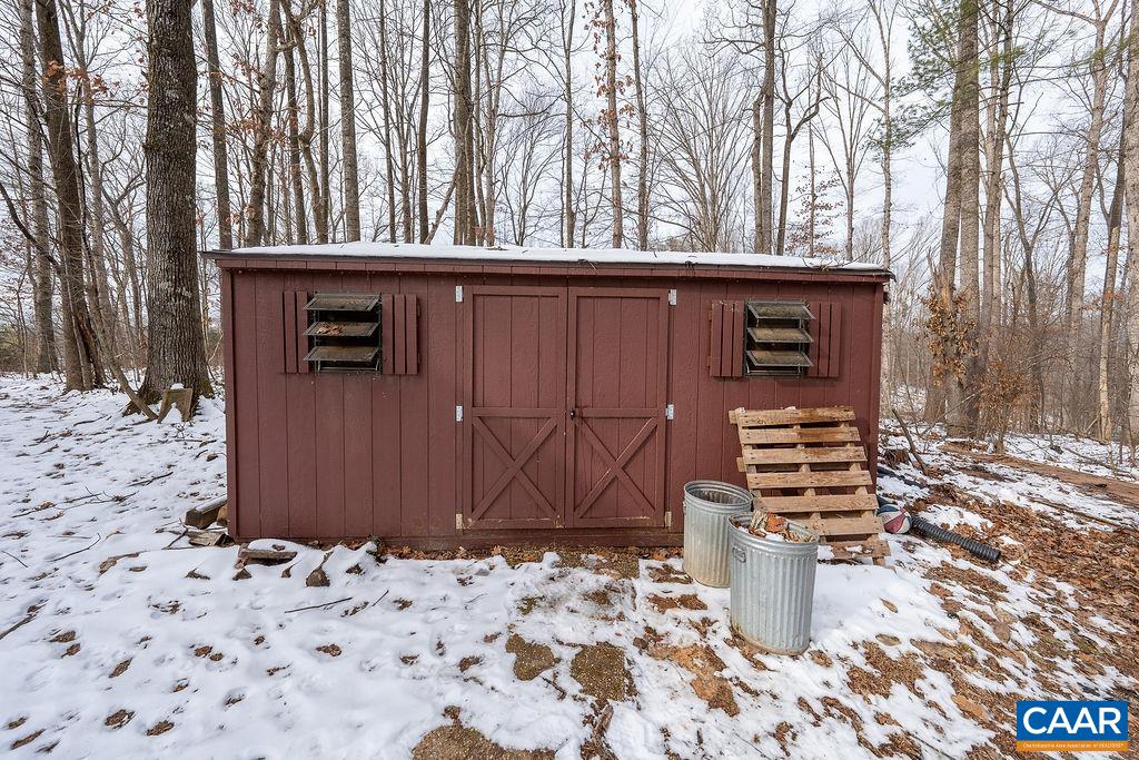 1425 Jacks Shop Road Rochelle, VA 22738 - Photo 53 of 66 a wooden bench sitting in front of a building