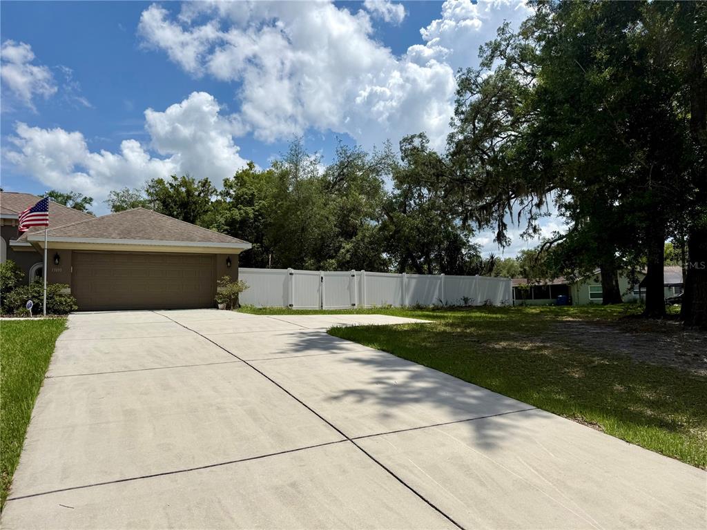13110 Bamboo Street Spring Hill, FL 34609 - Photo 4 of 56 a view of backyard of house with green space