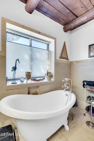 a bathroom with a sink a vanity and a window