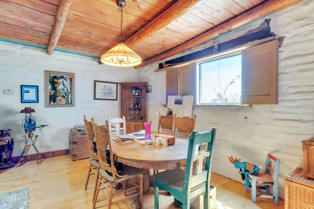 a view of a chairs and table in a room