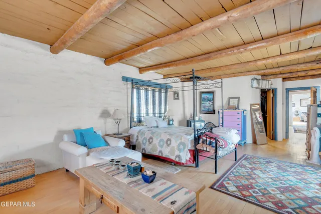 a spacious bathroom with a double vanity sink a mirror and a bathtub