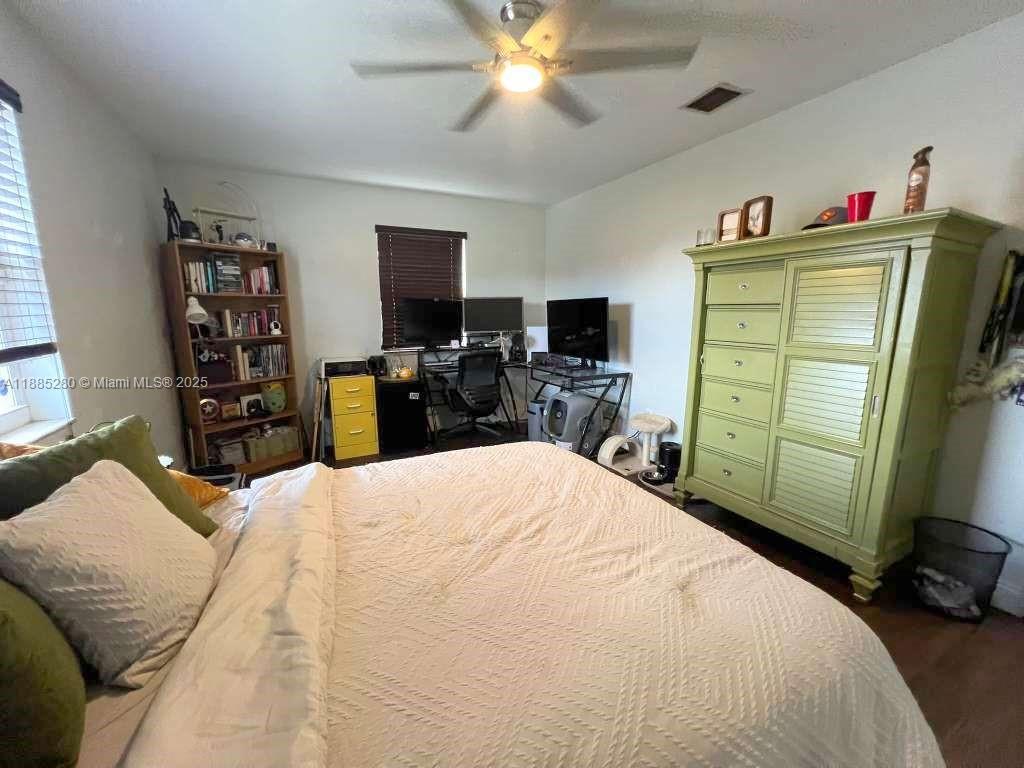 1130 Rutland Street Opa-Locka, FL 33054 - Photo 12 of 49 a bedroom with a bed and a television