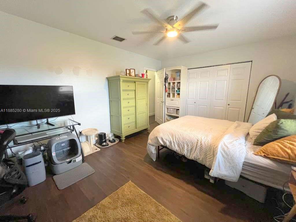 1130 Rutland Street Opa-Locka, FL 33054 - Photo 13 of 49 a bedroom with a bed and a flat screen tv