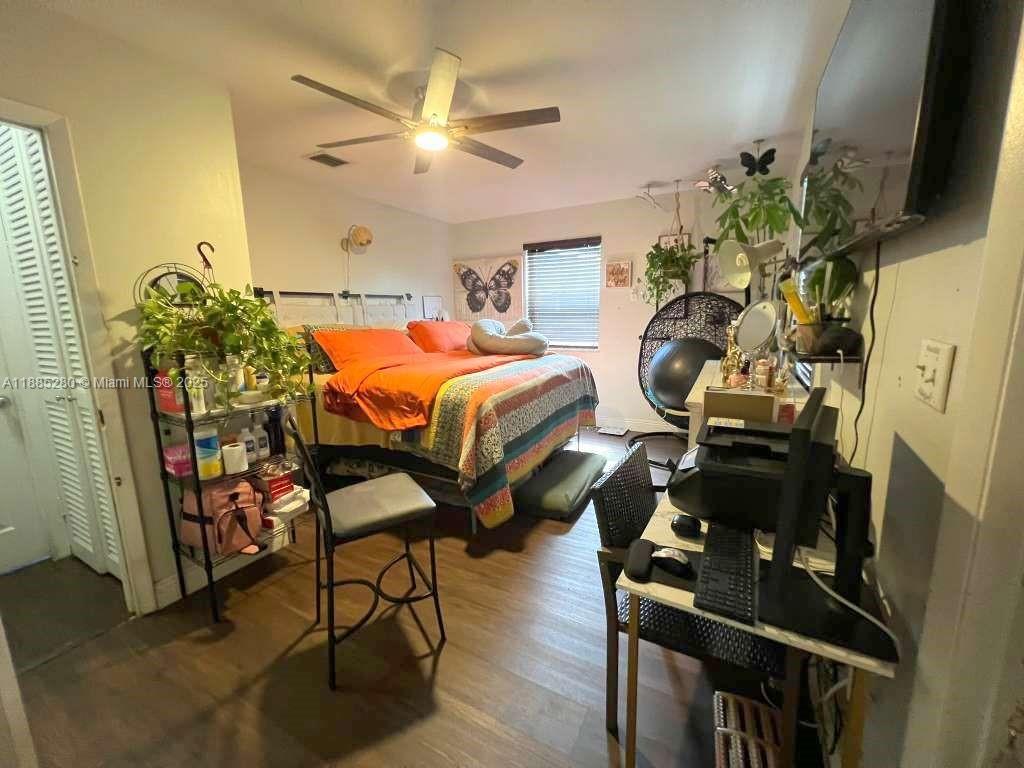 1130 Rutland Street Opa-Locka, FL 33054 - Photo 23 of 49 a bedroom with furniture and a chandelier