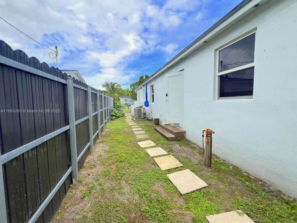1130 Rutland Street Opa-Locka, FL 33054 - Photo 28 of 49 a view of a backyard with pathway