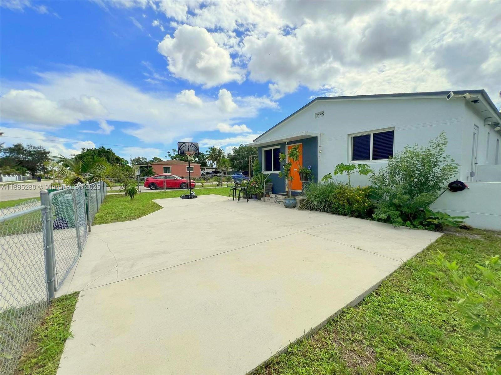 1130 Rutland Street Opa-Locka, FL 33054 - Photo 4 of 49 a view of a house with backyard and sitting area