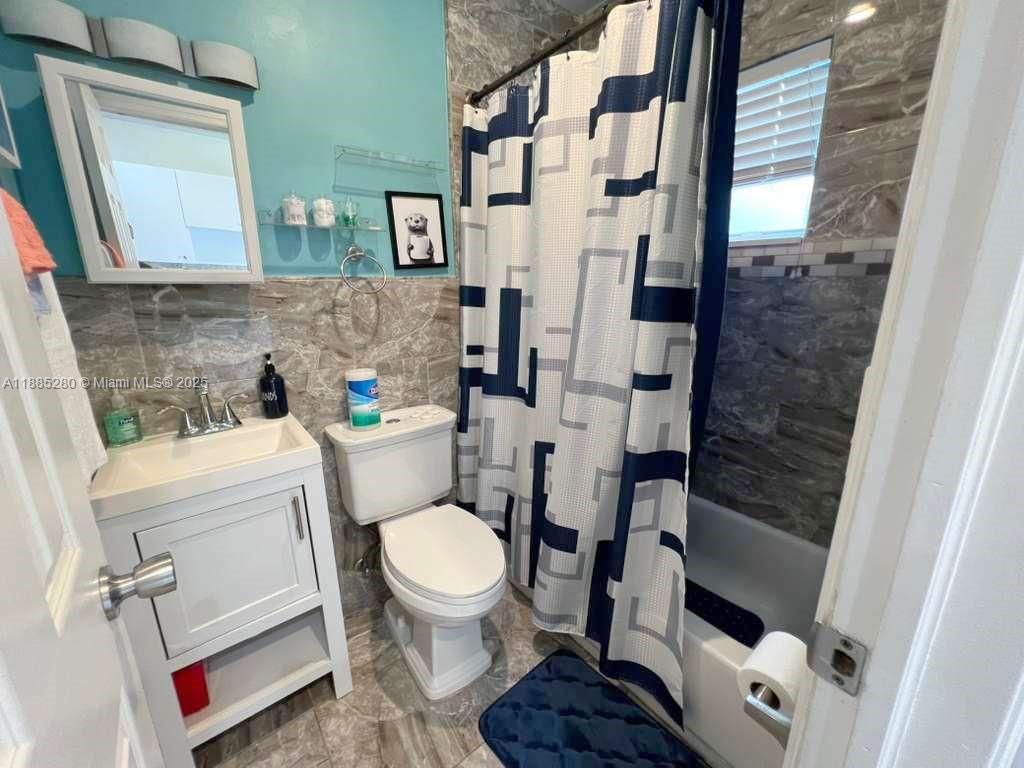 1130 Rutland Street Opa-Locka, FL 33054 - Photo 41 of 49 a bathroom with a toilet and a shower