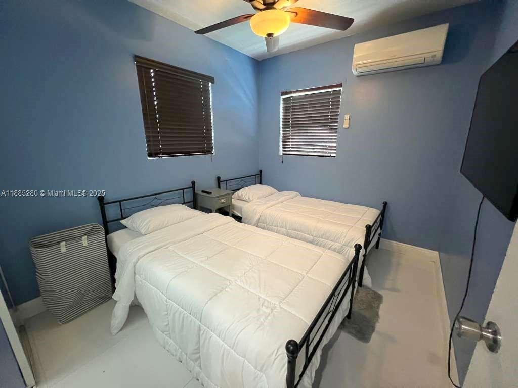 1130 Rutland Street Opa-Locka, FL 33054 - Photo 43 of 49 a en suite bathroom with sink and mirror