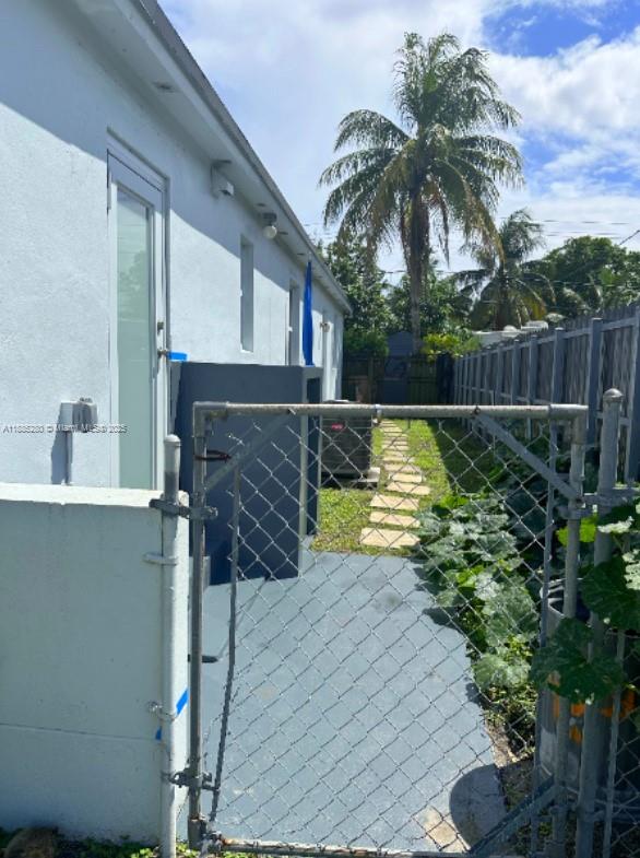 1130 Rutland Street Opa-Locka, FL 33054 - Photo 47 of 49 a view of a backyard house with swimming pool and furniture