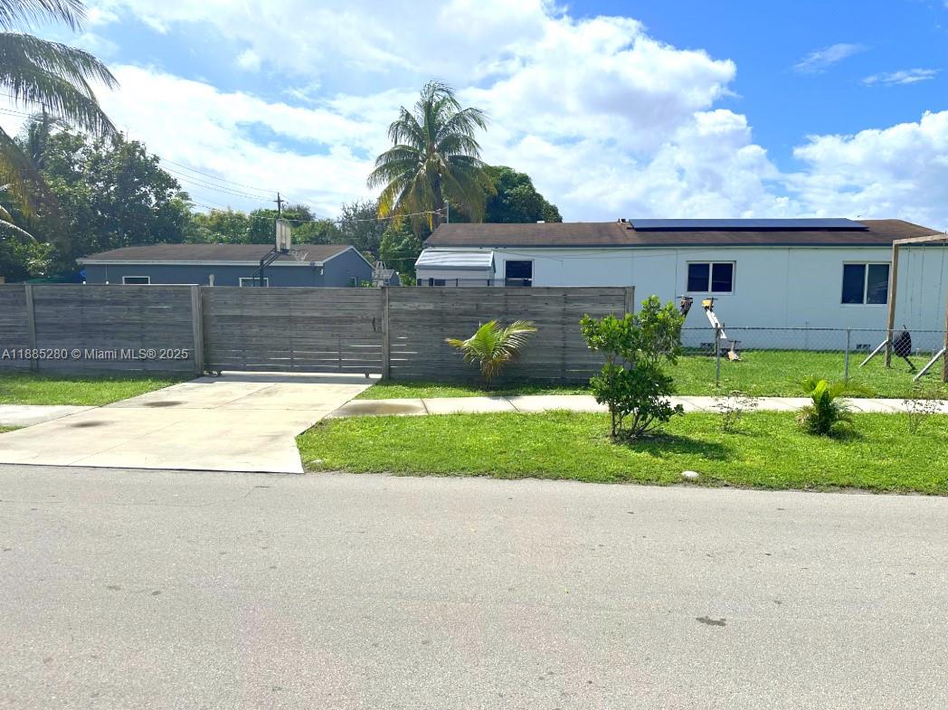 1130 Rutland Street Opa-Locka, FL 33054 - Photo 49 of 49 a view of a house with a yard and a fountain
