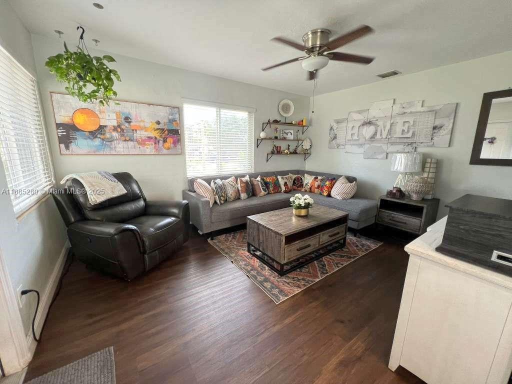1130 Rutland Street Opa-Locka, FL 33054 - Photo 6 of 49 a living room with furniture and a window