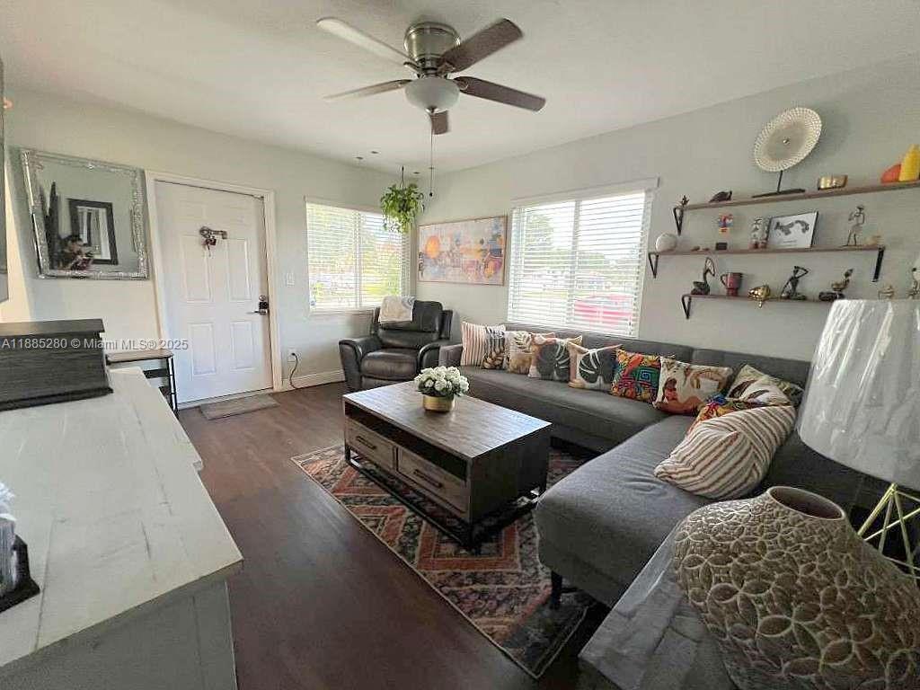 1130 Rutland Street Opa-Locka, FL 33054 - Photo 7 of 49 a living room with furniture and a large window