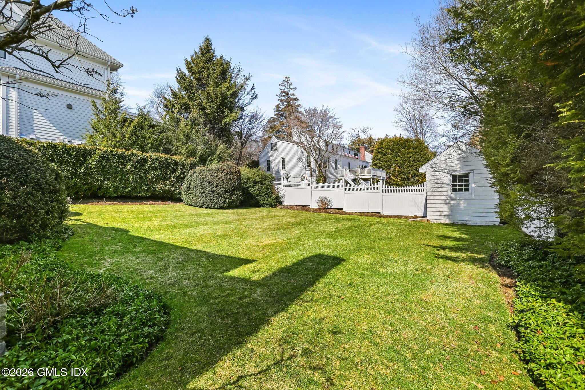 153 Lockwood Road Riverside, CT 06878 - Photo 47 of 58 a view of a house with a yard