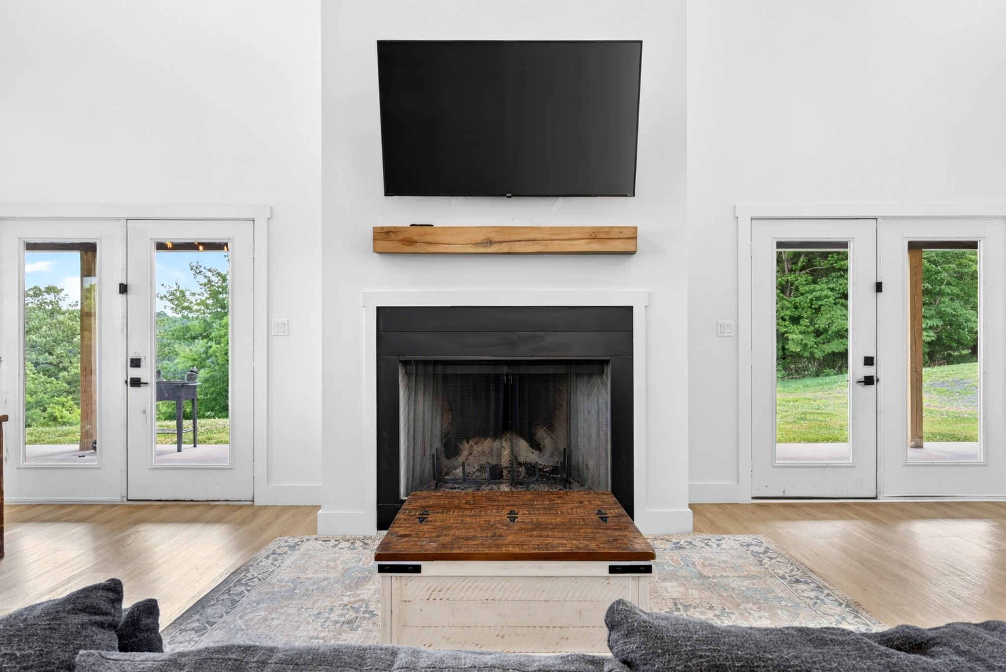 3485 Pinetree Circle Palmyra, TN 37142 - Photo 12 of 84 a living room with a fireplace and a flat screen tv
