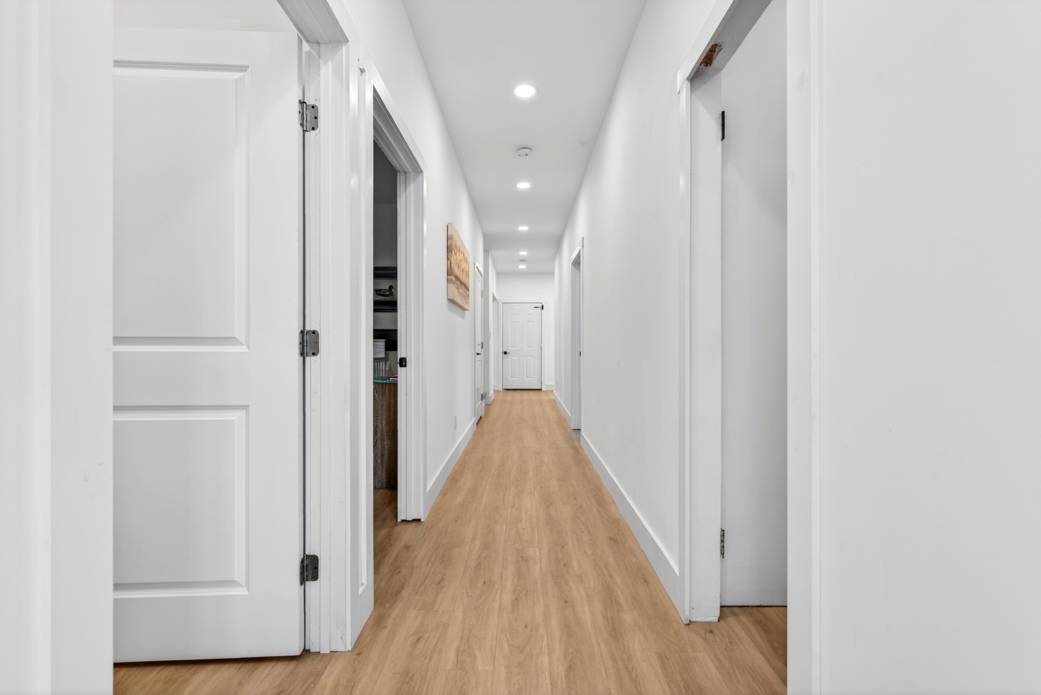 3485 Pinetree Circle Palmyra, TN 37142 - Photo 56 of 84 a view of a hallway with wooden floor and staircase
