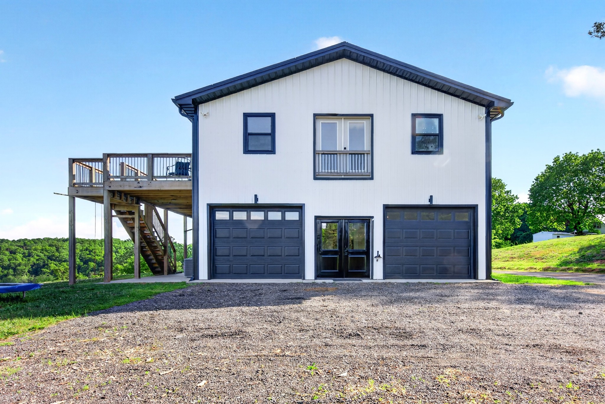 3485 Pinetree Circle Palmyra, TN 37142 - Photo 60 of 84 a view of a house with a yard and garage