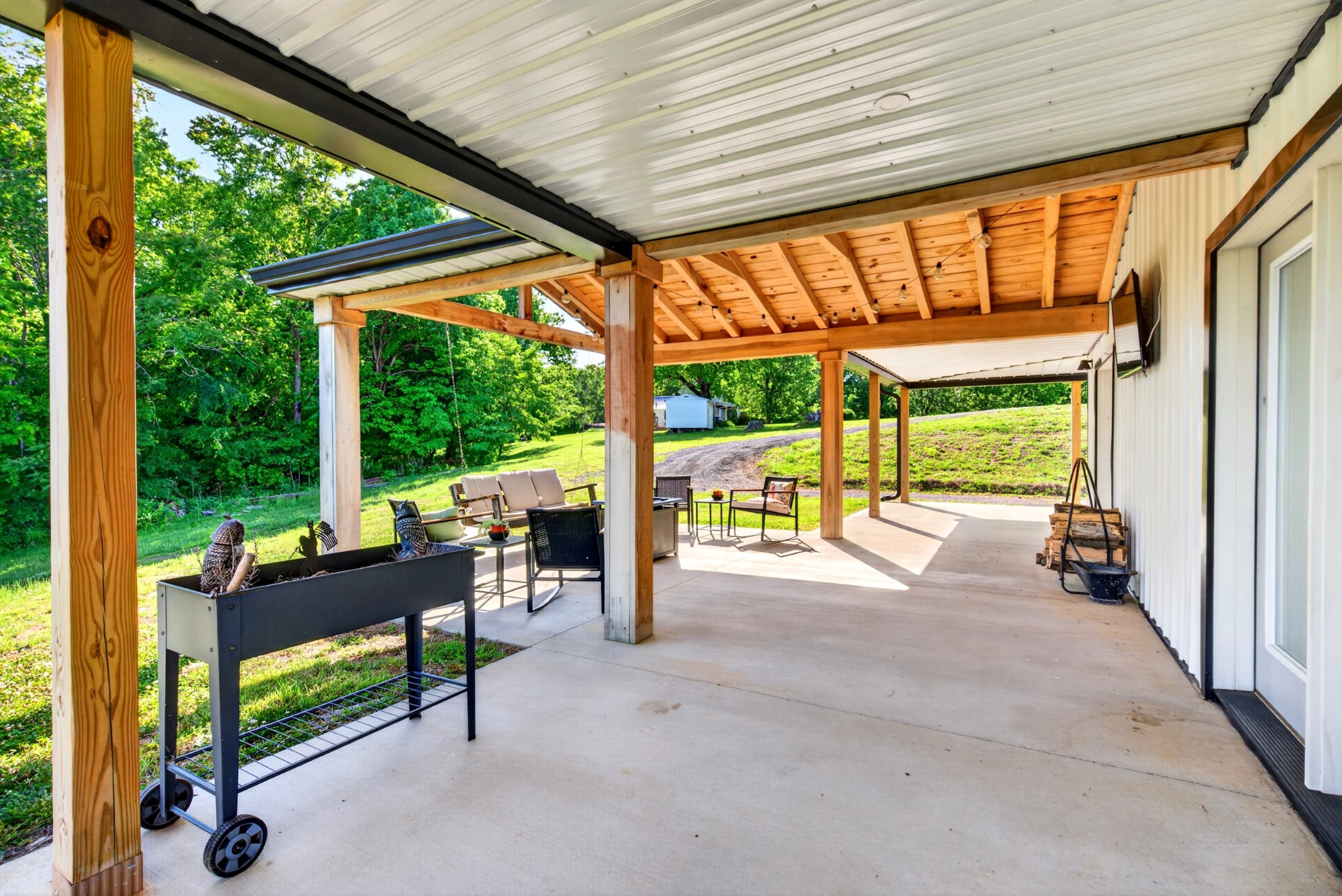 3485 Pinetree Circle Palmyra, TN 37142 - Photo 67 of 84 a view of a porch with chairs and backyard
