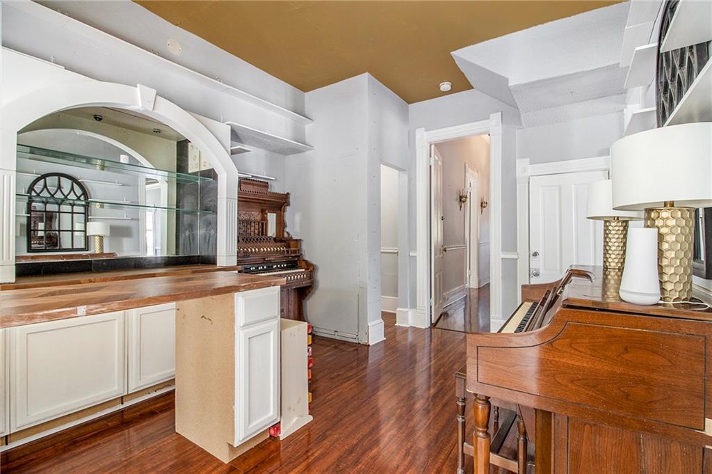1208 North Broad Street Rome, GA 30161 - Photo 15 of 63 a living room with stainless steel appliances furniture and a wooden floor