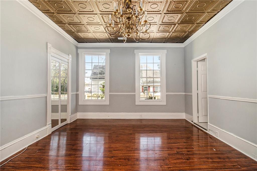 1208 North Broad Street Rome, GA 30161 - Photo 19 of 63 a view of an empty room with wooden floor and a window