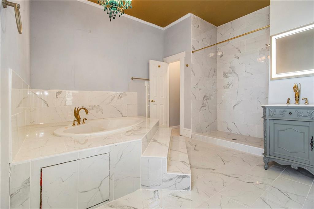 1208 North Broad Street Rome, GA 30161 - Photo 26 of 63 a bathroom with a sink a toilet and shower