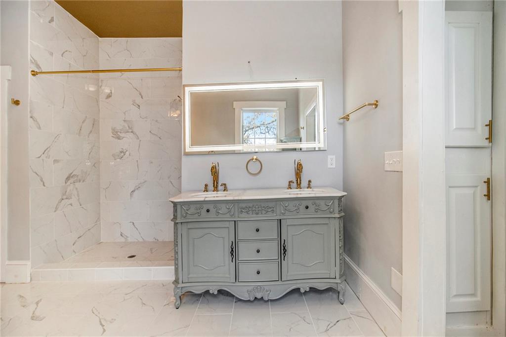 1208 North Broad Street Rome, GA 30161 - Photo 27 of 63 a bathroom with a sink and a mirror